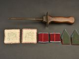 a small knife and some small cards on a table