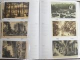 an open book with pictures of trees and animals in it