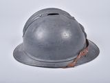 a helmet that is sitting on a white surface