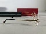 a pair of glasses sitting on a table next to a pair of glasses