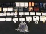 a lot of perfumes and perfume bottles on the table
