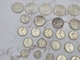 a lot of coins sitting on a marble surface