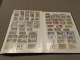 an open book with a bunch of stamps on it