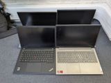 two laptops sitting on the floor next to each other