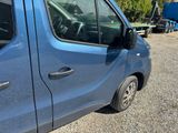 a blue van that is parked in a lot