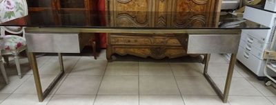 a table with a glass top in a room