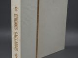 an open white book sitting on top of a gray surface