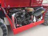 a red truck with a large engine in the back of it