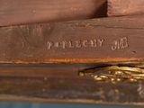 a close up of a piece of wood with a clock on it
