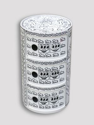 a white and black cabinet with a clock on it
