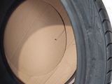 a close up of a tire with a cardboard box inside of it