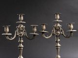 a pair of silver plated candelabs with four arms