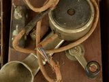 an old suitcase with a bunch of items inside of it