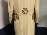 an image of a coat on a mannequin stand