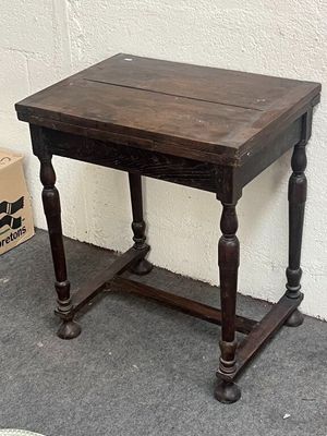 a small table with a wooden top on the floor