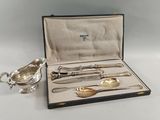 a silverware set in a case with spoons and spoons in it