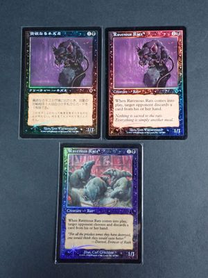 three cards are on a table with a black background