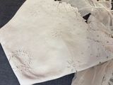 an image of a piece of white lace on a bed