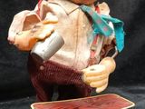 a statue of a man with a hat on top of a box