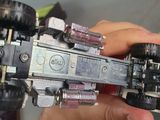 a man holding a model of a spaceship in his hand