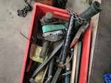 a red box full of tools and chains on the floor
