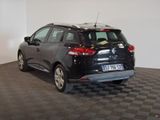 a picture of a small black car parked in a room