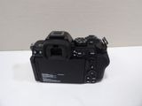a close up of a camera on a table with a white background