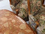 several chairs and a table in a room with a table and chairs