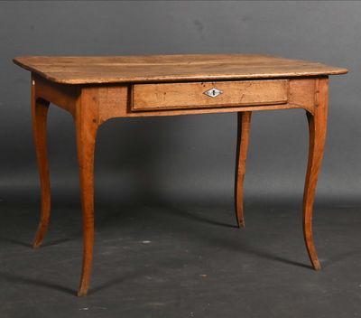 an old wooden table with a drawer on top of it