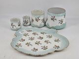 a picture of a blue and white floraled bathroom set
