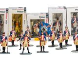 six figurines of soldiers in uniform standing in front of a box