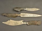 three different types of knifes are displayed on a gray surface