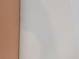 an open notebook on a white surface with a brown paper cover