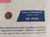 a picture of a bag of toilet paper that has a coin on it