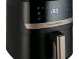 an image of a black and silver air fryer on a white background