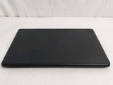 an open laptop computer sitting on top of a white surface