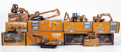 many different models of construction equipment in a pile
