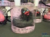 many different types of rubber ducks in a jar