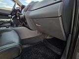 a view of the inside of a car from the driver ' s seat
