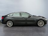 the bmw 6 series sedan is parked in a showroom