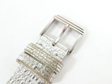 an image of a close up of a watch strap on a white surface