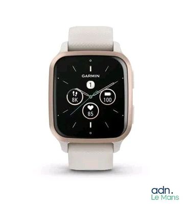 a white smart watch with a black face on a white surface