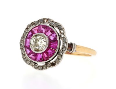a close up of a pink and white diamond ring on a white background
