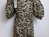 a dress with a zebra print on it on a mannequin stand