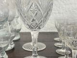 a lot of wine glasses sitting on a table