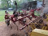 an image of a tractor with a plow attached to it