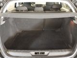 the back of a car with the trunk open and the seats down