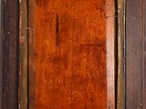 a close up of an old wooden frame with a brown stain on it
