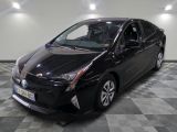 a picture of a black toyota prius parked on a checkered floor