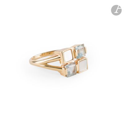 a close up of a gold ring with a stone in the middle